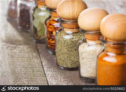 different spices on wooden table