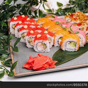 different sushi rolls on a big plate