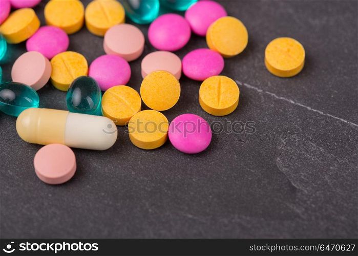 different tablets pills capsule heap mix therapy drugs. Tablets pills