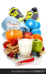 Different tools for sport and diet food on white background - sport, health and diet concept