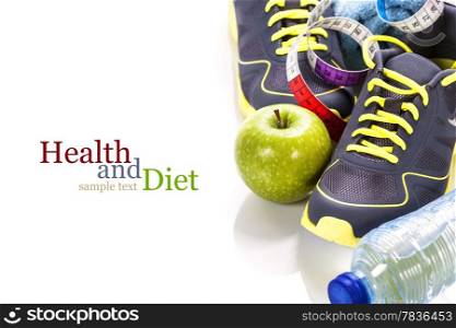 Different tools for sport and healthy food for diet on white background - sport, health and diet concept