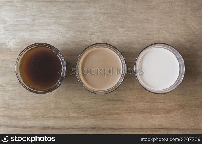 different type beverage wooden texture backdrop