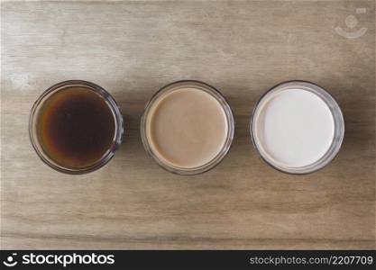 different type beverage wooden texture backdrop