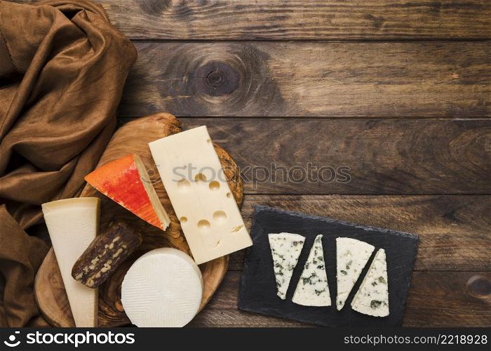different types cheeses brown silk textile table
