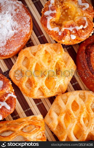 different types of biscuits on bamboo napkin, top view