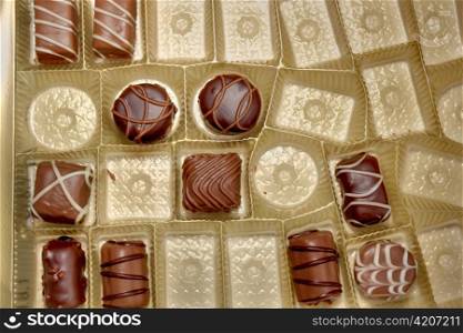different types of chocolate candies in a candy box
