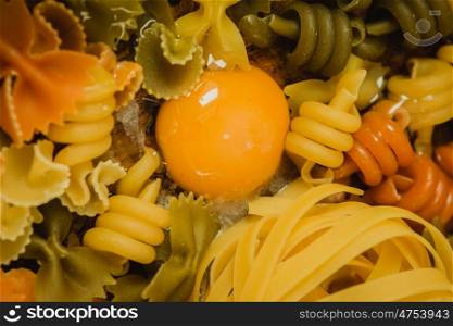 different types of colored pasta with various shapes