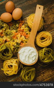 different types of colored pasta with various shapes