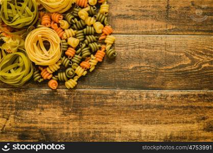 Different types of colored pasta with various shapes