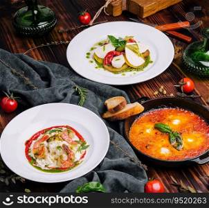 different types of italian dishes on a large wooden table