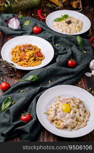 different types of italian pasta in bowls