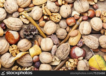 Different types of nuts.Natural background made from different kinds of nuts.. Mix nuts close up