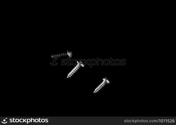 different types of screws on black isolated background