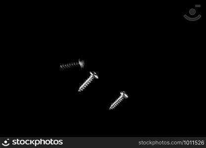 different types of screws on black isolated background