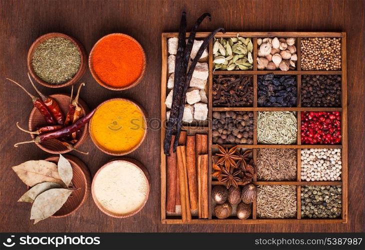 Different types of spices in wooden box