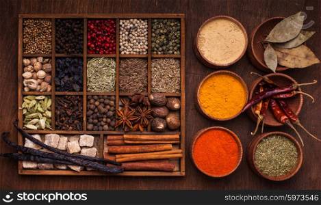 Different types of spices in wooden box. Spice set