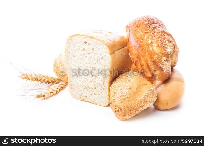 Different types of wheat bread and buns isolated on white. The Wheat bread