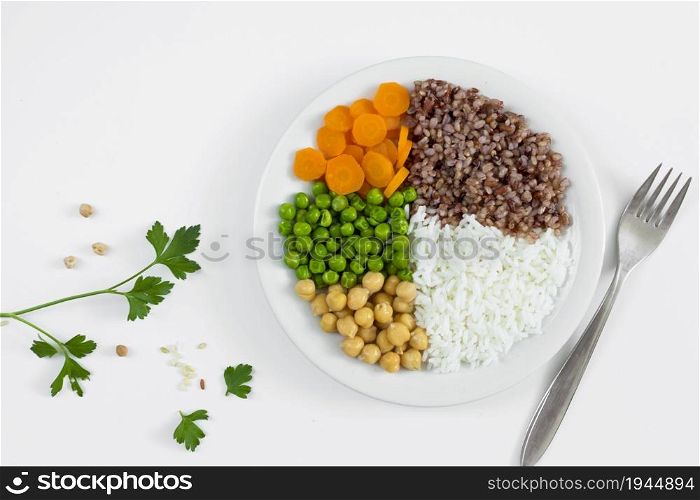 different types porridge with vegetables plate. none