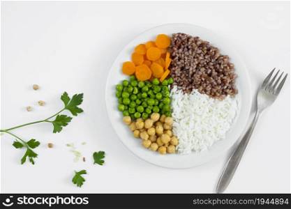 different types porridge with vegetables plate. none