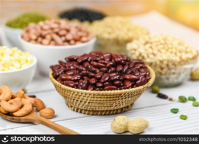 Different whole grains red beans and legumes seeds lentils and nuts colorful / Collage various red kidney beans mix peas agriculture of natural healthy food for cooking ingredients