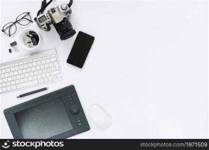 digital camera graphic digital tablet keyboard mouse cellphone white background. High resolution photo. digital camera graphic digital tablet keyboard mouse cellphone white background. High quality photo
