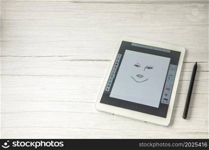 Digital creative artist tablet with pen for drawing, modern art technology concept on wooden office desk, copy space top view space for text. Digital creative artist tablet with pen for drawing, modern art technology concept on wooden office desk, copy space top view