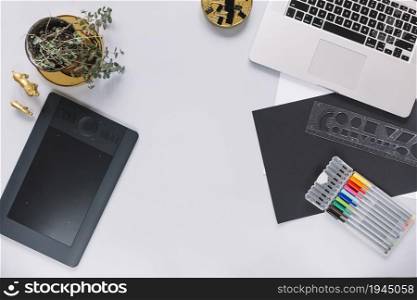 digital graphic tablet laptop mock up with office objects white background. High resolution photo. digital graphic tablet laptop mock up with office objects white background. High quality photo