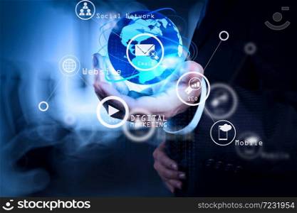 Digital marketing media (website ad, email, social network, SEO, video, mobile app) in virtual screen.businessman working with new modern computer show social network structure.