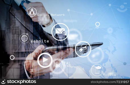 Digital marketing media (website ad, email, social network, SEO, video, mobile app) in virtual screen.Double exposure of businessman working with new modern computer show social network structure as concept.