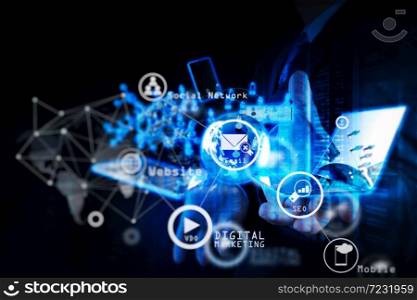 Digital marketing media (website ad, email, social network, SEO, video, mobile app) in virtual screen.Double exposure of businessman shows modern technology as concept.