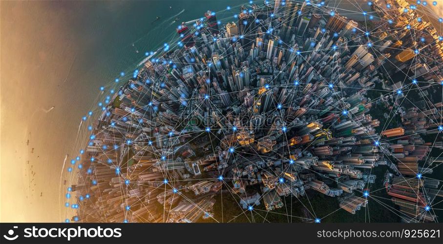 Digital network connection lines of Hong Kong Downtown. Financial district and business centers in smart urban city in technology concept. Skyscraper and high-rise buildings. Aerial view at sunset