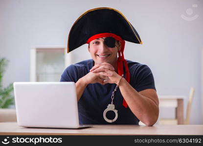 Digital security concept with pirate at computer