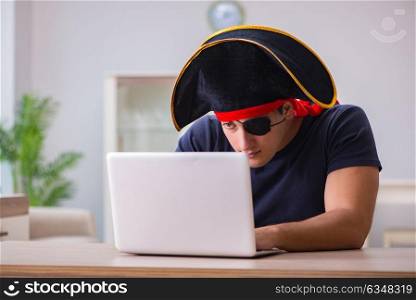 Digital security concept with pirate at computer