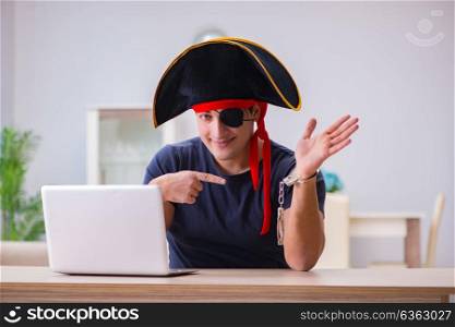 Digital security concept with pirate at computer