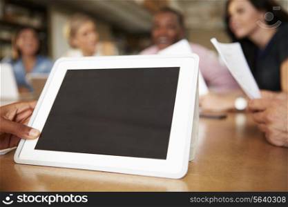 Digital Tablet Being Used By Architect In Meeting