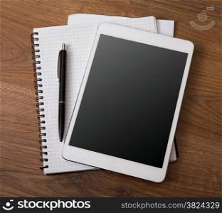 digital tablet on a wooden background