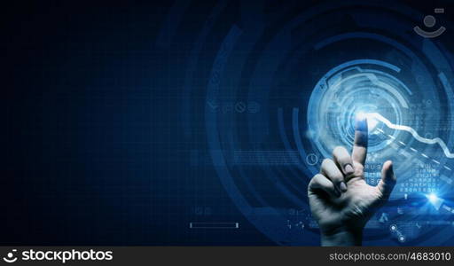 Digital technlogies in use. Close up of businessman touching virtual panel with finger