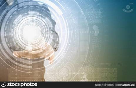 Digital technlogies in use. Close up of businessman touching virtual panel with finger