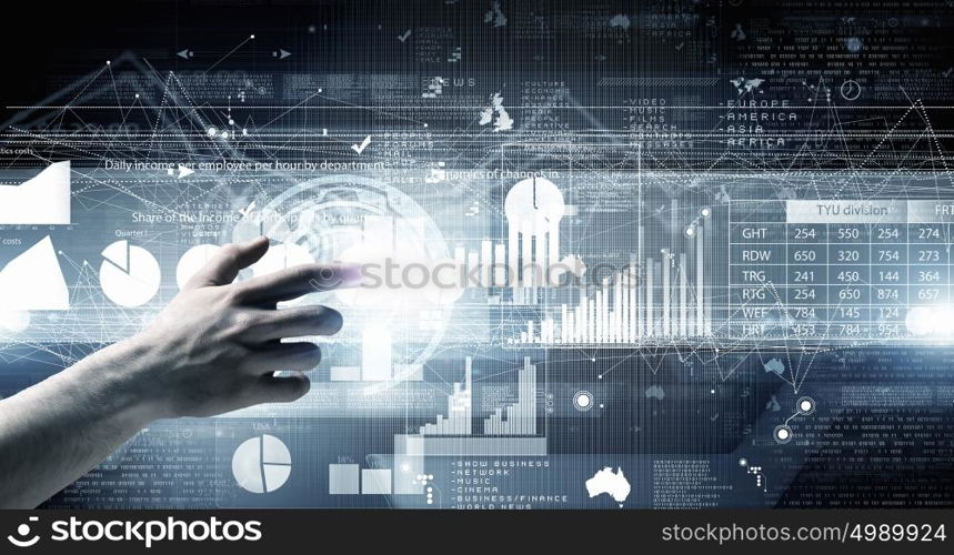 Digital technlogies in use. Close up of businessman touching virtual panel with finger