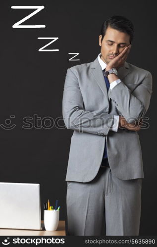 Digitally generated image of young businessman sleeping in office