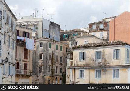 Dilapidated buildings in the backstreets of Corfu Town, Greece, where poverty leaves once grand houses to decay