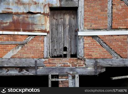 Dilapidated Warwickshire barn facade, England.