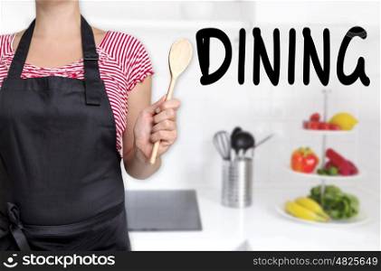 dining cook holding wooden spoon background concept. dining cook holding wooden spoon background concept.
