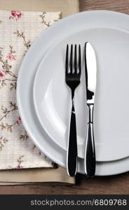 Dining etiquette - I still eat, finished. Fork and knife signals with location of cutlery set.