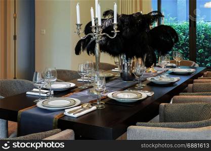 dining table and chairs in modern home with elegant table setting