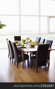 Dining table with empty chairs in a dining room