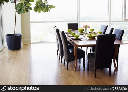 Dining table with empty chairs in a dining room