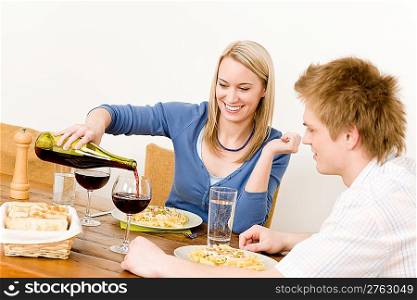 Dinner romantic couple enjoy red wine eat pasta at home