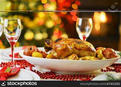 dinner with chicken near Christmas tree