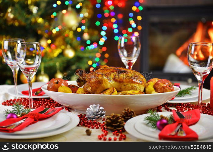 dinner with chicken near Christmas tree